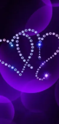 This mesmerizing live phone wallpaper showcases a diamond heart on a purple background, surrounded by blue fireflies and floating beads of light