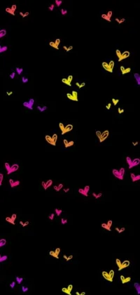 Looking for a fun and trendy live wallpaper for your phone? Check out this vibrant heart-themed design! Against a sleek black background, colorful graffiti-styled hearts bounce and sway in an eye-catching animation