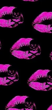 This phone live wallpaper features a fun and lively pattern of pink lips on a black background