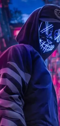 Get lost in the futuristic world of this cyberpunk phone live wallpaper! Featuring a mysterious figure adorned in cyberpunk streetwear and a neon mask, this edgy live wallpaper incorporates elements like flames, a joystick, and bold neon colors