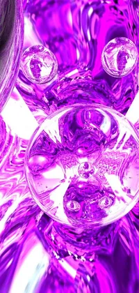 This stunning phone live wallpaper depicts a purple glass vase that appears like a soap bubble on a table