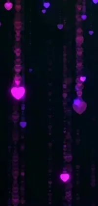 This phone live wallpaper features a mesmerizing digital rendering of hearts hanging from the ceiling
