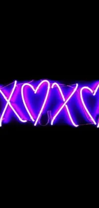 This live wallpaper features a neon sign with the message "xoxo" on a purple background