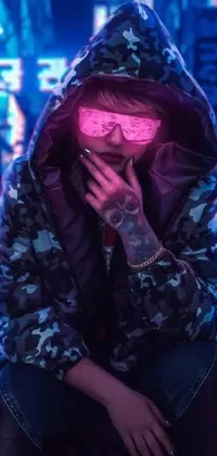 This cyberpunk live wallpaper features a figure in a hoodie smoking with pink and blue lighting adding a futuristic aesthetic