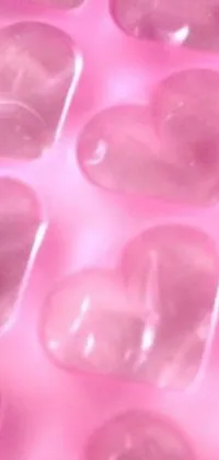 Add a touch of elegance to your phone with this stunning live wallpaper featuring a close-up view of melting ice cubes