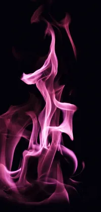 This stunning phone live wallpaper showcases vibrant pink smoke amidst a black background, complemented by a glowing fire backdrop
