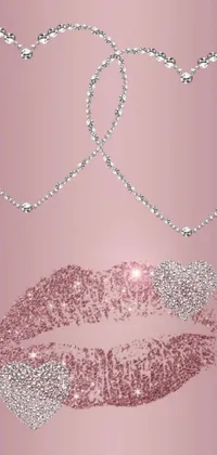 Get a stunning phone wallpaper featuring a close-up of a lipstick on a pink background with diamond accents