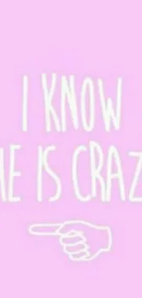 This lively phone wallpaper features a vibrant pink background adorned with the bold statement "I know she is crazy