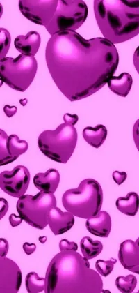 This vibrant phone live wallpaper features a sea of shiny purple hearts set against a soft pink background