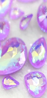 This gorgeous phone live wallpaper showcases a mesmerizing display of purple crystals atop a table, complemented by a charming tear drop design and holo effect