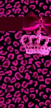 This trendy live wallpaper showcases a pink crown on a leopard print background