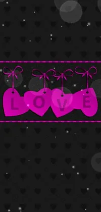 Looking for an adorable and romantic live wallpaper for your phone? Check out this design featuring two pink hearts on a sleek black background with purple ribbons