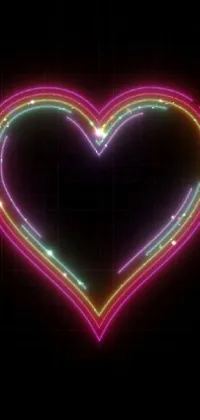 If you're looking for a bold and eye-catching phone wallpaper, this neon heart design on a black background is sure to impress