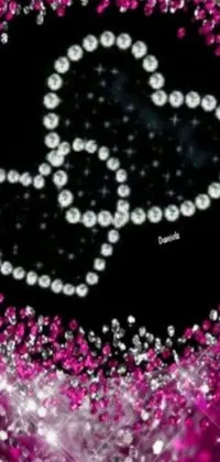 This phone live wallpaper features a stunning heart made out of sparkling diamonds set on a soft pink background