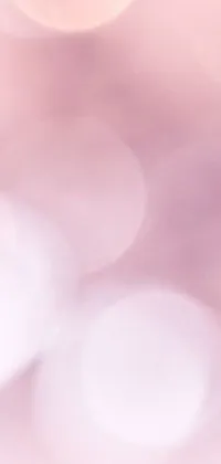 This beautiful live phone wallpaper features a close-up of a toothbrush against a soft, blurred pink background