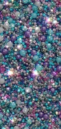 This phone live wallpaper features a beautiful glitter background in shades of purple and blue, with an elegant jewelry-inspired design