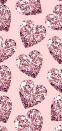 This live wallpaper for your phone features a collection of pink hearts on a pastel-pink background, adorned with dazzling diamonds in a crystal cubism style