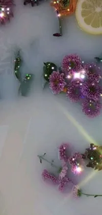 This phone live wallpaper features an enchanting bathtub brimming with flowers and lemon slices