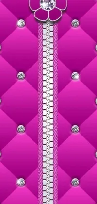 This phone live wallpaper features a stunning pink background adorned with shimmering diamonds arranged in a zipper formation and customized LV jewelry
