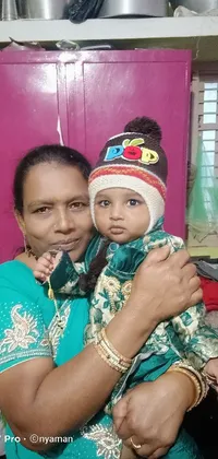 This Assamese-inspired phone live wallpaper depicts a tender moment between a woman and a baby
