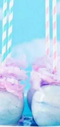 If you're craving a cute and colorful phone background, then this live wallpaper is perfect for you! The design features two soft and fluffy marshmallows resting on a white plate, surrounded by a cozy tumblr backdrop of blue and purple fur