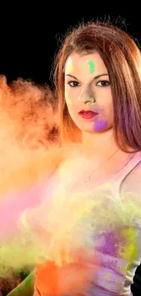 Get this vibrant and energy-packed phone live wallpaper featuring a woman with bright colored powder on her face