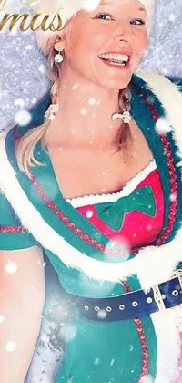 This live phone wallpaper depicts a festive scene of a woman dressed as Santa Claus in the midst of snowy surroundings