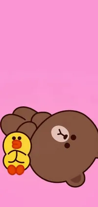 This live phone wallpaper features a brown bear and a yellow bird resting in the sun on a pink background