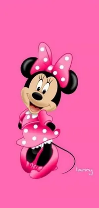 This lively phone wallpaper features a playful Minnie Mouse perched atop a vibrant pink surface, providing a cheerful backdrop for your device