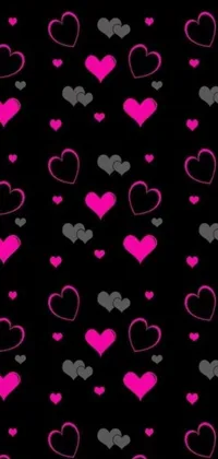 This phone live wallpaper features a delightful collection of pink heart patterns on a sleek black background with Disney-esque flair