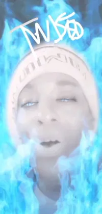 This live wallpaper features a close-up shot of a person donning a hat, with blue fire and smoke swirling about them