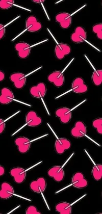 This lively phone wallpaper boasts a repeating pattern of hot pink and black lollipop illustrations, perfectly seamless with scattered heart symbols