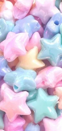 Add a pop of fun to your phone with this playful live wallpaper featuring a pile of multicolored stars