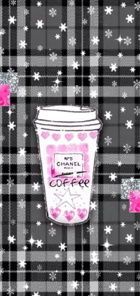 Add a playful touch to your phone with this pop-art inspired live wallpaper! Featuring a digital rendering of a coffee cup atop a soft flannel backdrop, this design is as vibrant and captivating as it is cozy
