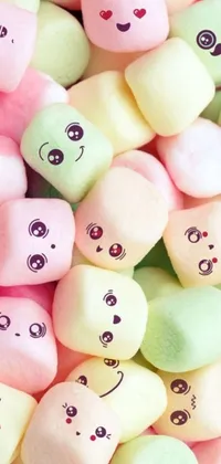 Bring a touch of sweetness to your phone with this live wallpaper featuring a pile of pastel-colored marshmallows with adorable faces