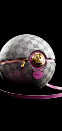 This live wallpaper features a close-up view of a designer LV purse, rendered digitally on a black background