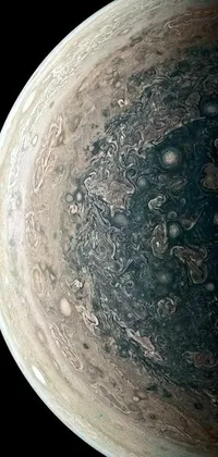 This live wallpaper features a stunning close-up of a planet with a marbled appearance against a black background