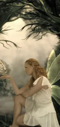 This stunning live wallpaper depicts a woman in a white dress holding a butterfly in a fairy kingdom forest