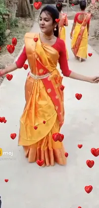 This stunning live wallpaper features a woman draped in a vibrant sari walking along a whimsical path adorned with heart symbols