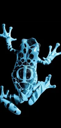 This live phone wallpaper showcases a stunning digital art painting of a close up of a blue frog with light-blue skin and a full-body view of its colorful spotted pattern on a black background