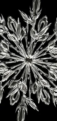 This striking phone live wallpaper features a photorealistic black and white rendering of a snowflake with incredible detail and realism