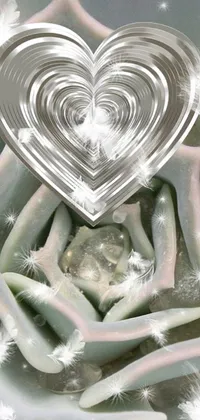 This phone live wallpaper features a lovely close-up of a flower with a heart in the center, surrounded by cactus and pearls, and shimmering white sparkles