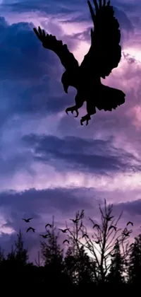 This striking live wallpaper features a digital art scene of a bird flying in the night sky, surrounded by distant eagles silhouetted against the dark background