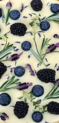 This phone live wallpaper depicts a delicious pie with berries on a pastel background adorned with baroque designs and lavender plants