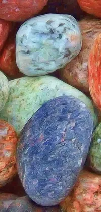This live wallpaper showcases a stunning pile of colorful rocks arranged in an artful, haphazard manner