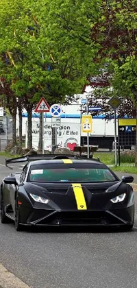 This phone live wallpaper features a black Lamborghini Huracan driving down a street in Dunwall