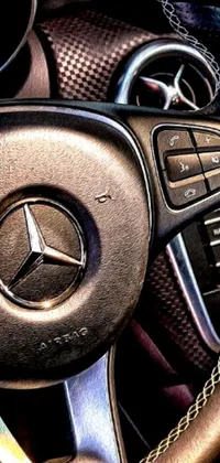 Experience a captivating live wallpaper that showcases a stunning close-up shot of a mercedez benz steering wheel