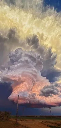 This phone live wallpaper depicts a large cloud in the sky over a dirt road, surrounded by symbols such as a heart, fire, mushroom, and tornado