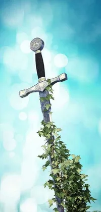 Get mesmerized with this live phone wallpaper of an ancient sword resting on top of a tree on a sunny day