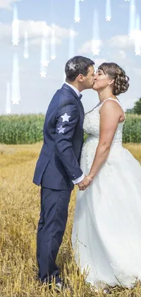 This exquisite live phone wallpaper depicts a romantic scene of a couple locked in a loving kiss within a field of hay